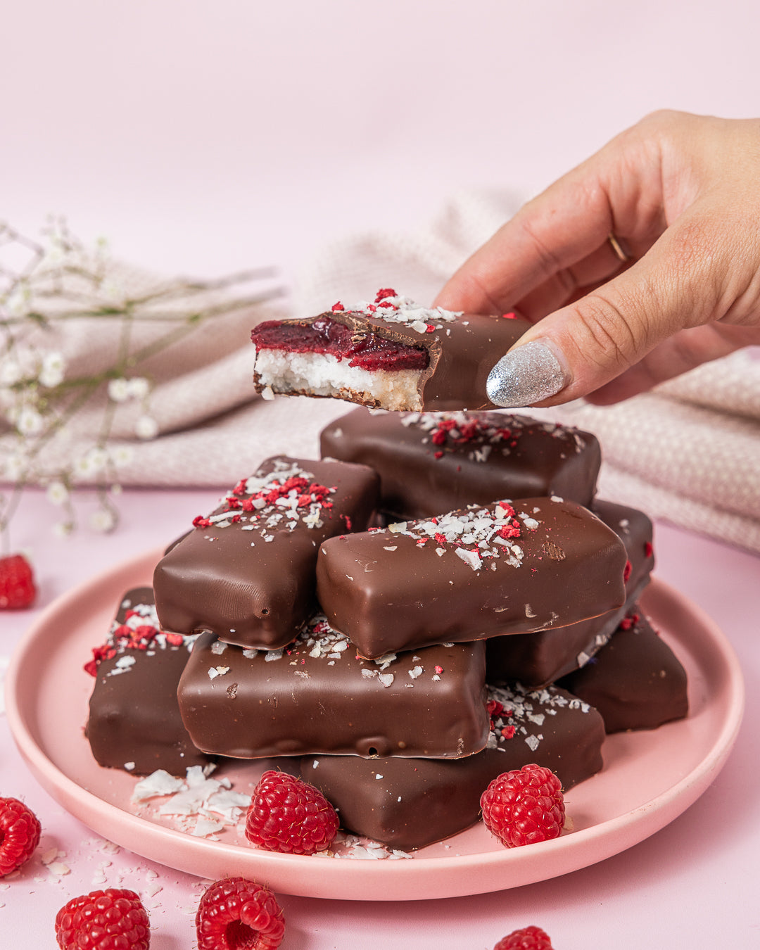 Raspberry Ripe Bars gluten-free vegan chocolate coconut bars by Crumble Charms with fresh raspberries