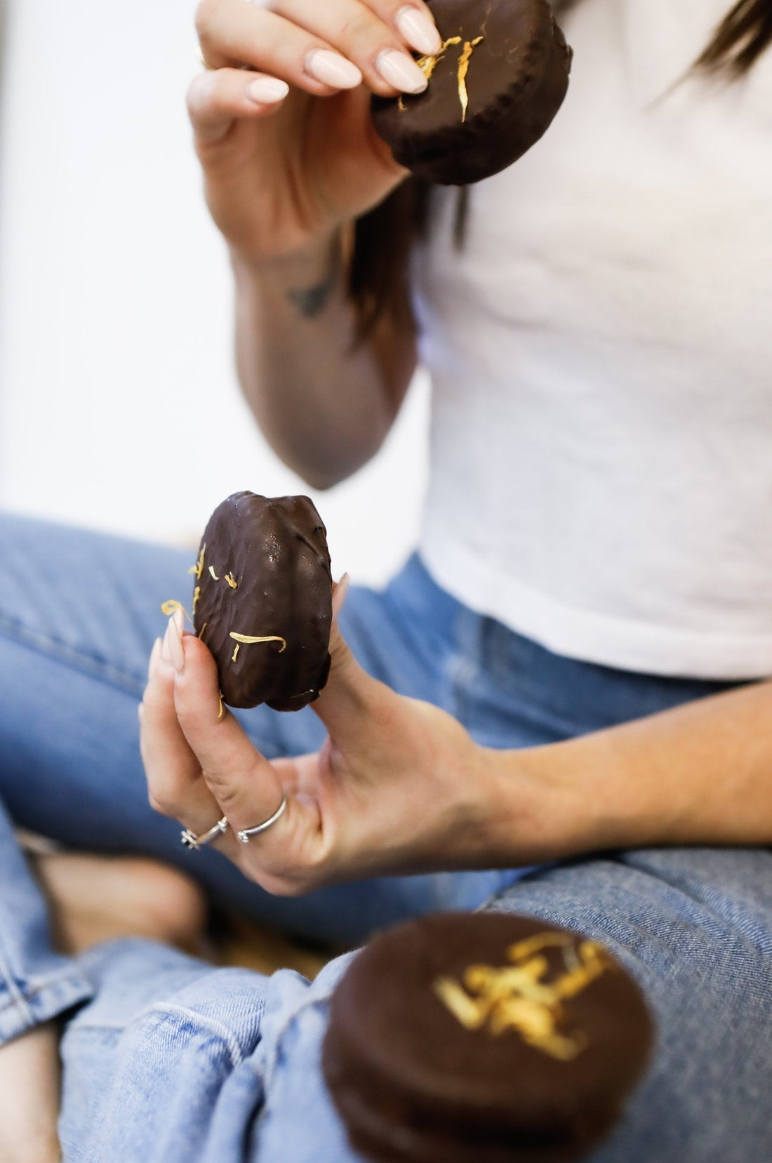 Person holding Raspberry Love Wheels by Crumble Charms – gluten-free vegan chocolate wagon wheels
