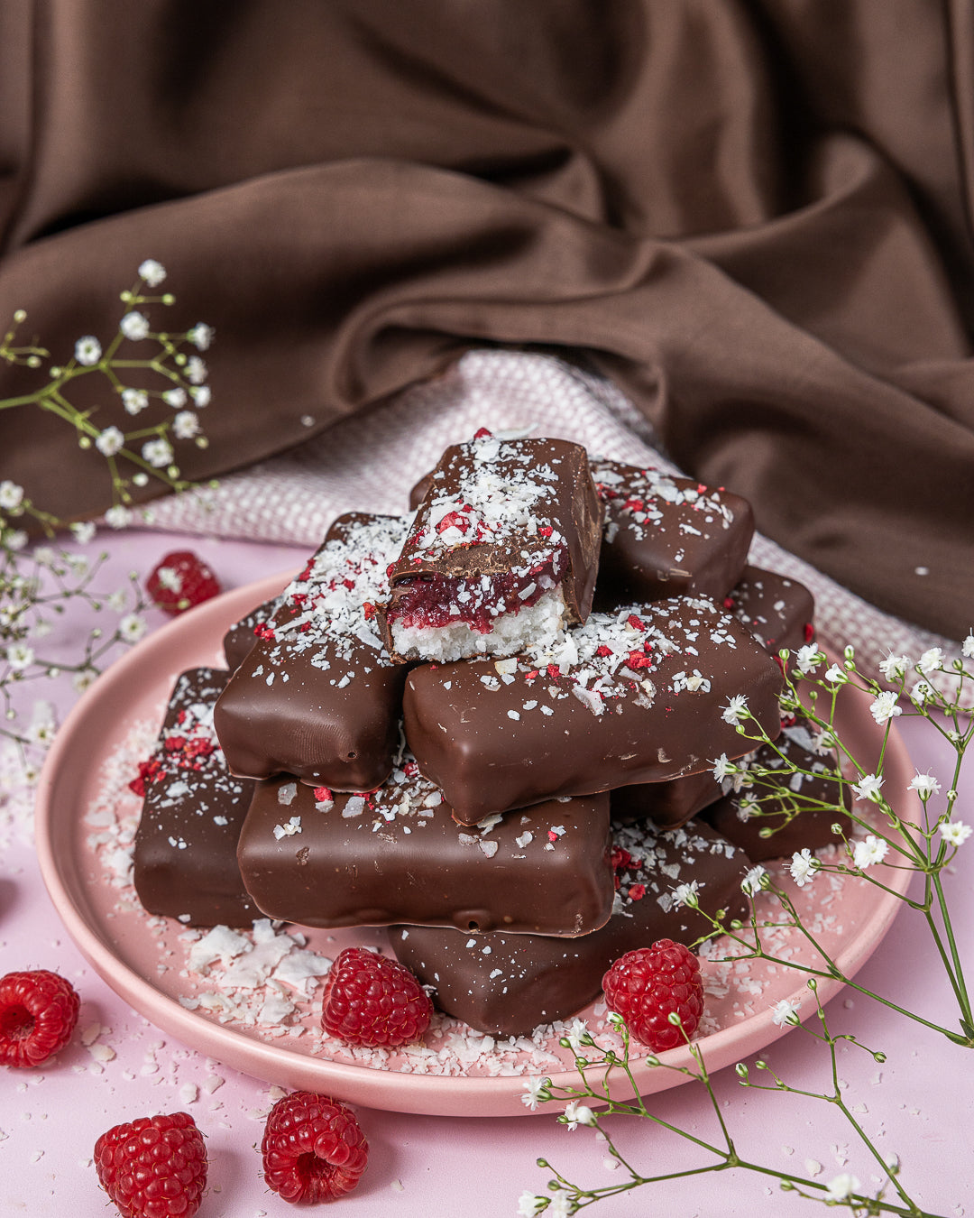 Raspberry Ripe Bars gluten-free vegan chocolate coconut bars by Crumble Charms with fresh raspberries